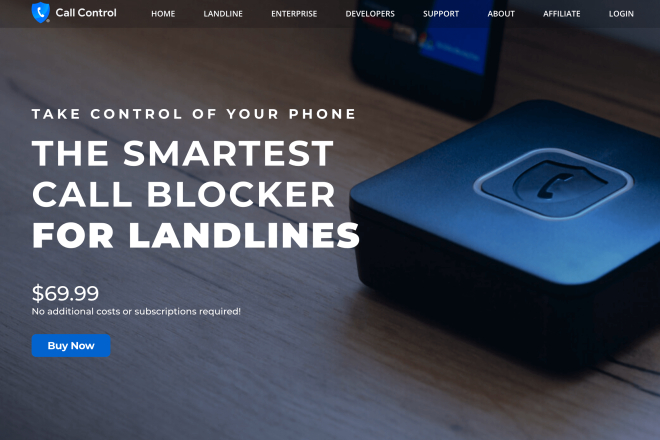 Call Control landline call blocker device on a wood surface with a smartphone in the background.