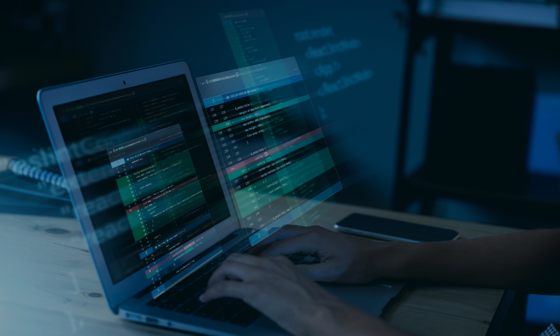 Hands coding on laptop with overlaid software development code for cybersecurity.