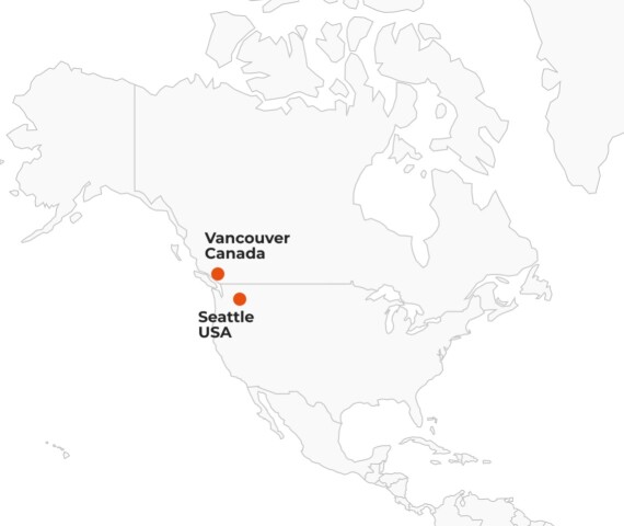 Map displaying the location of Seattle, USA, and Vancouver, Canada, with connecting line.
